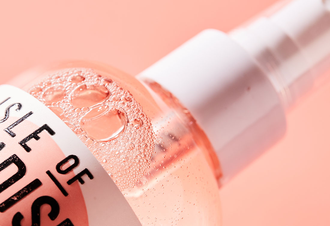 extreme close up of bubbles in a bottle of light water